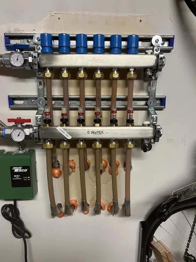 Plumber performing Water Heater Repair at a residential property in Heath